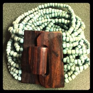 Beaded bracelet with wood clasp.